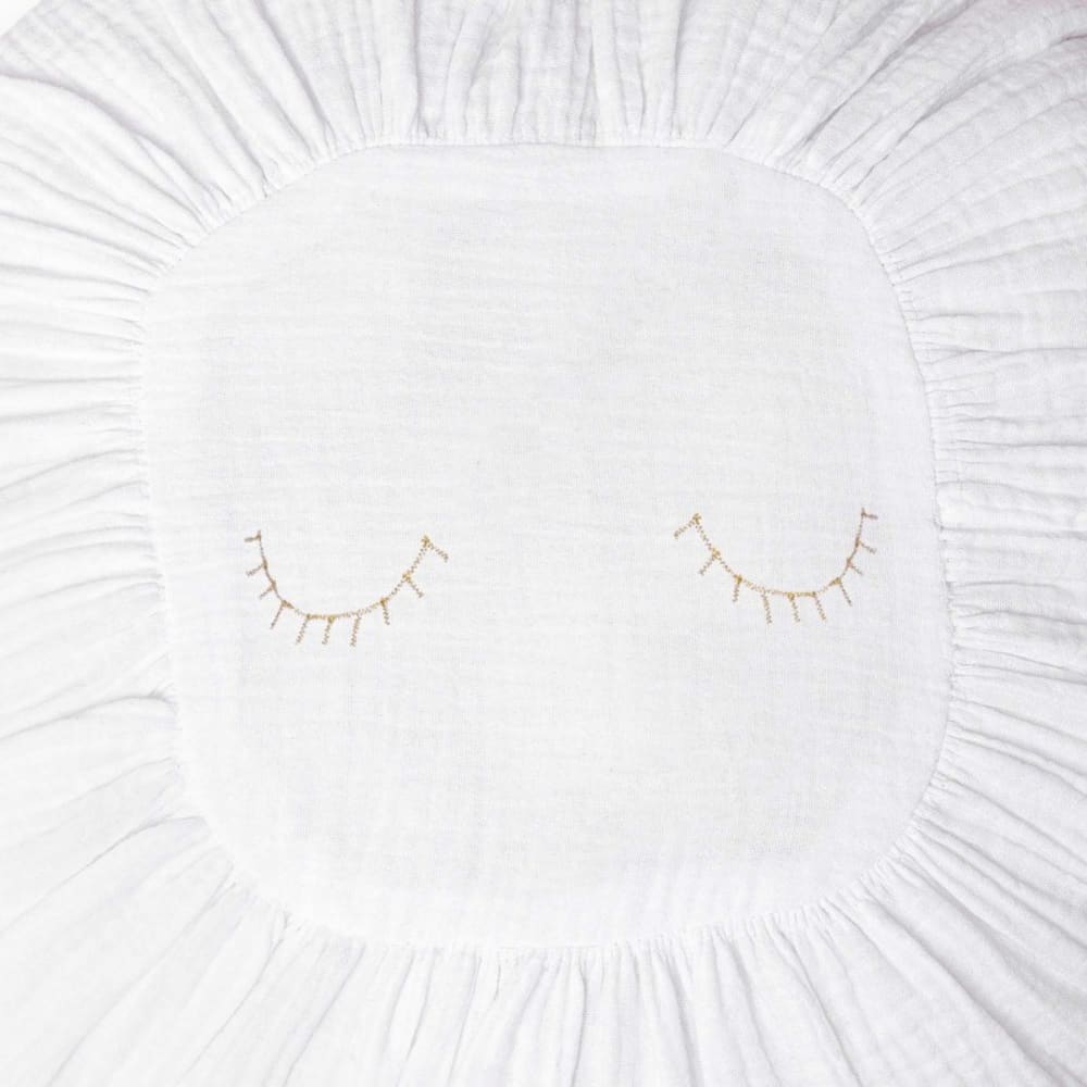 Coussin MueMue rond blanc avec détails brodés dorés pour salon ou chambre — vue 2