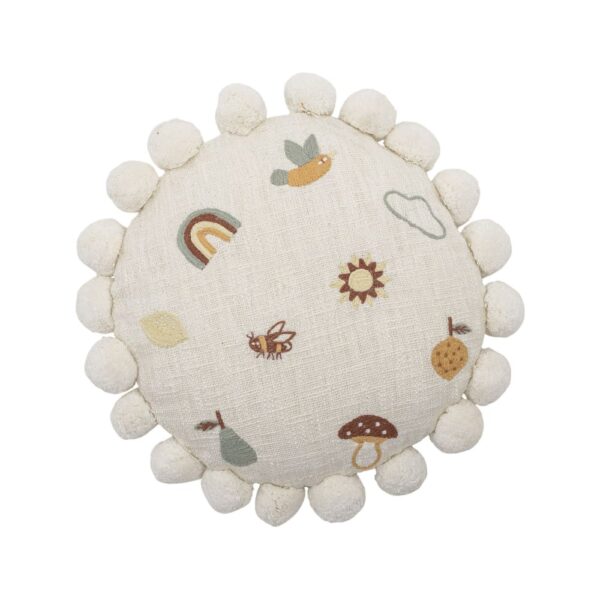 Coussin en coton Bloomingville blanc carré posé dans un intérieur lumineux